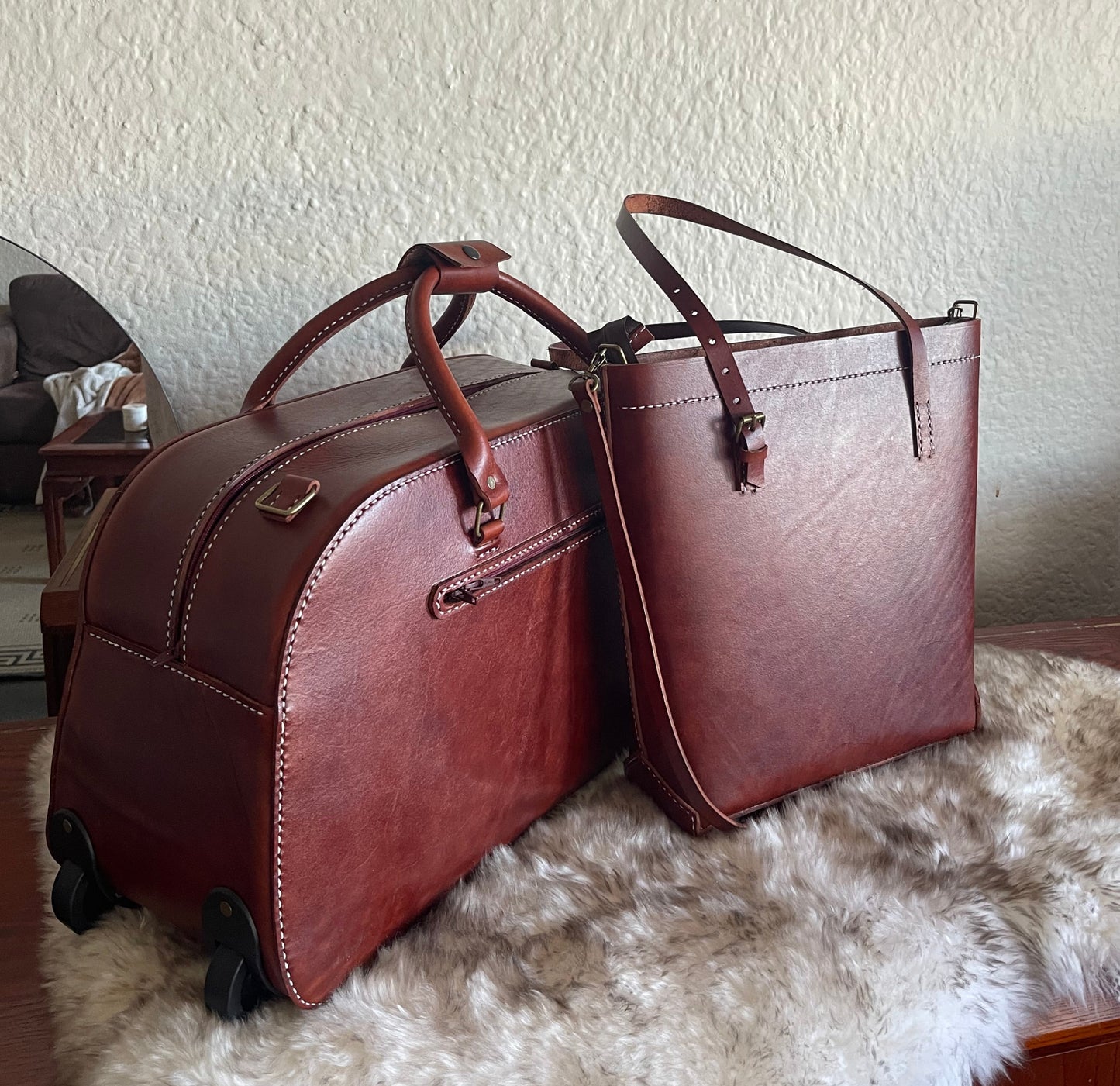 Oak hand-stitched Genuine leather trolley bag and a handbag  next to it