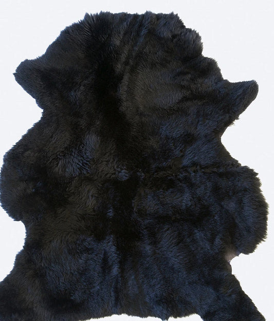 Genuine black sheepskin laid flat down