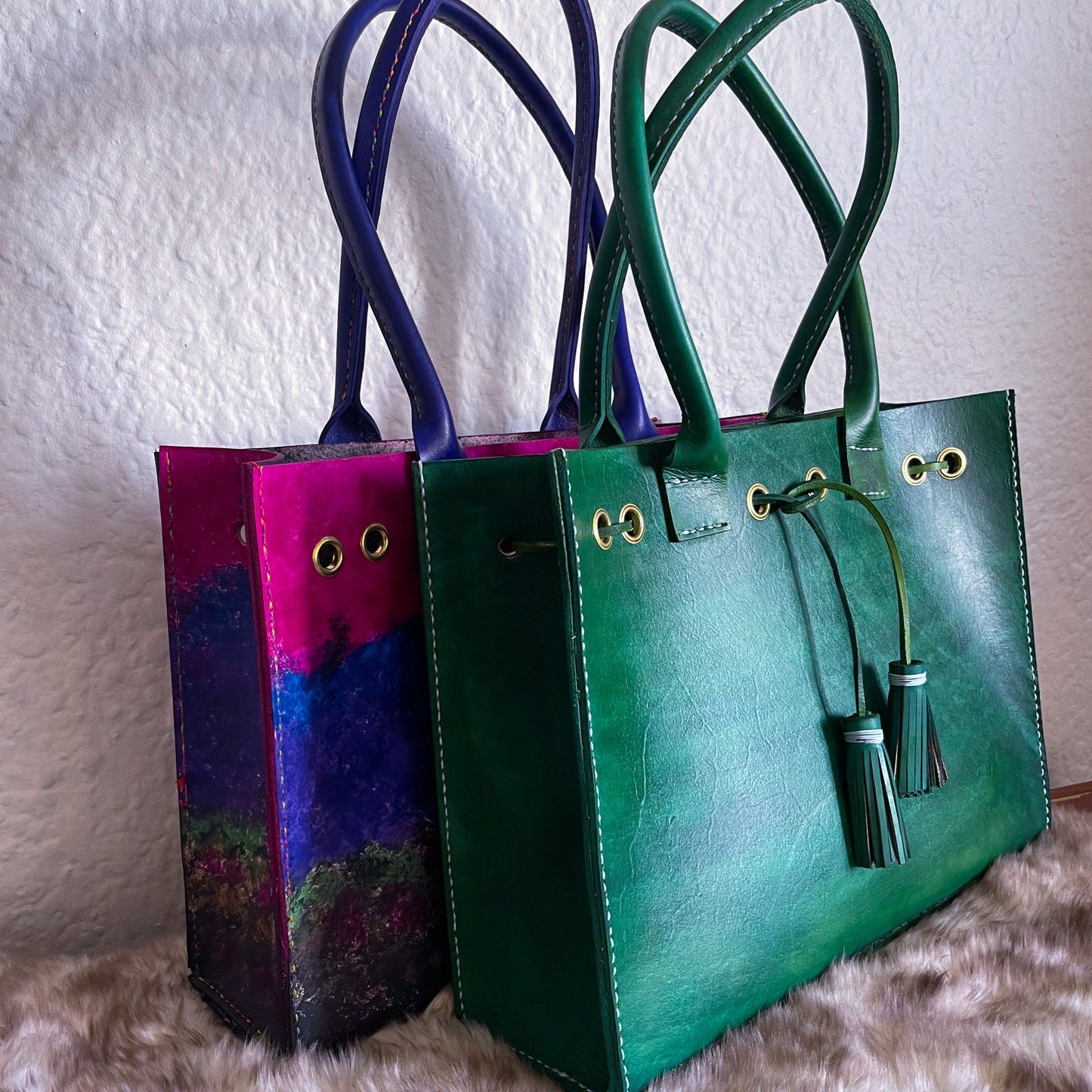 two genuine leather hand-stitched tote bag with tassels 