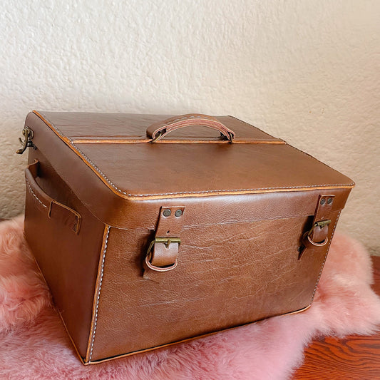 genuine leather large brown gift box on a pink sheepskin