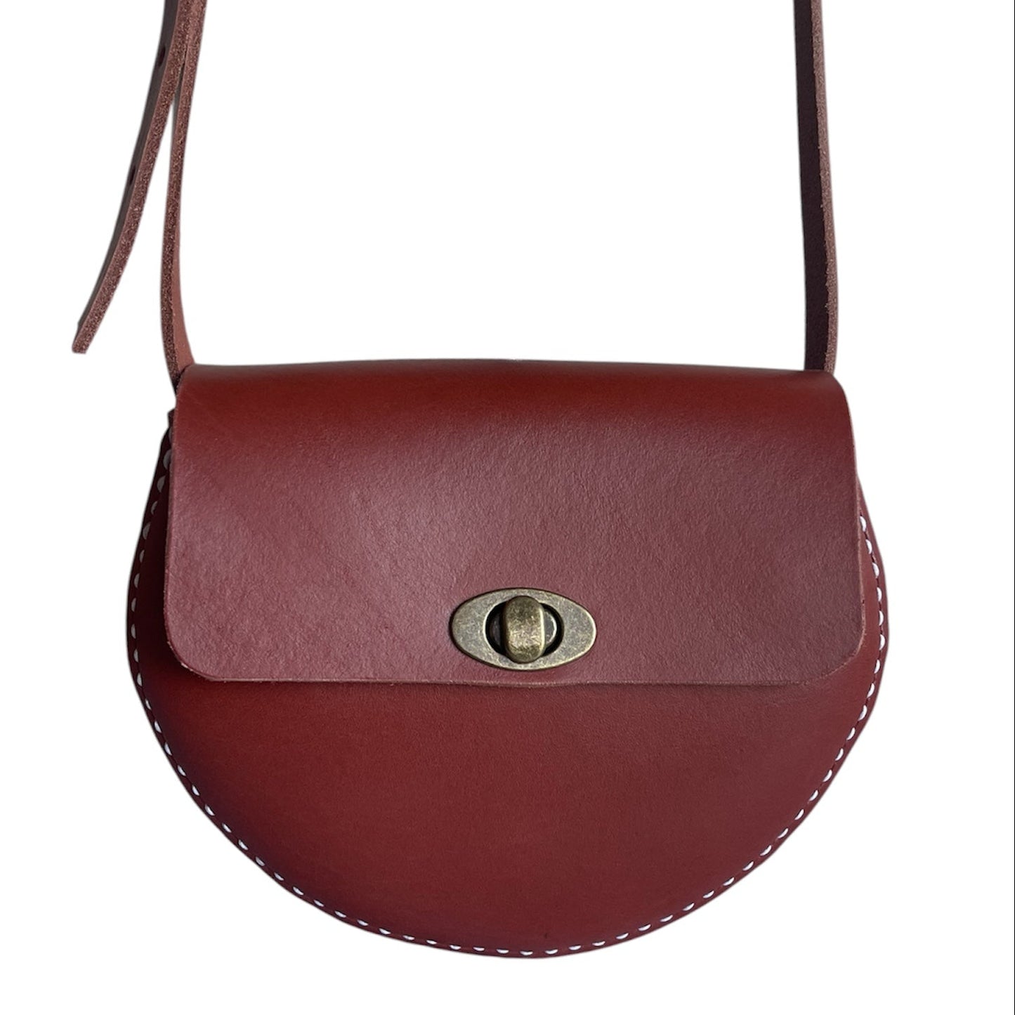 Brown leather handbag with a gold clasp on a white background