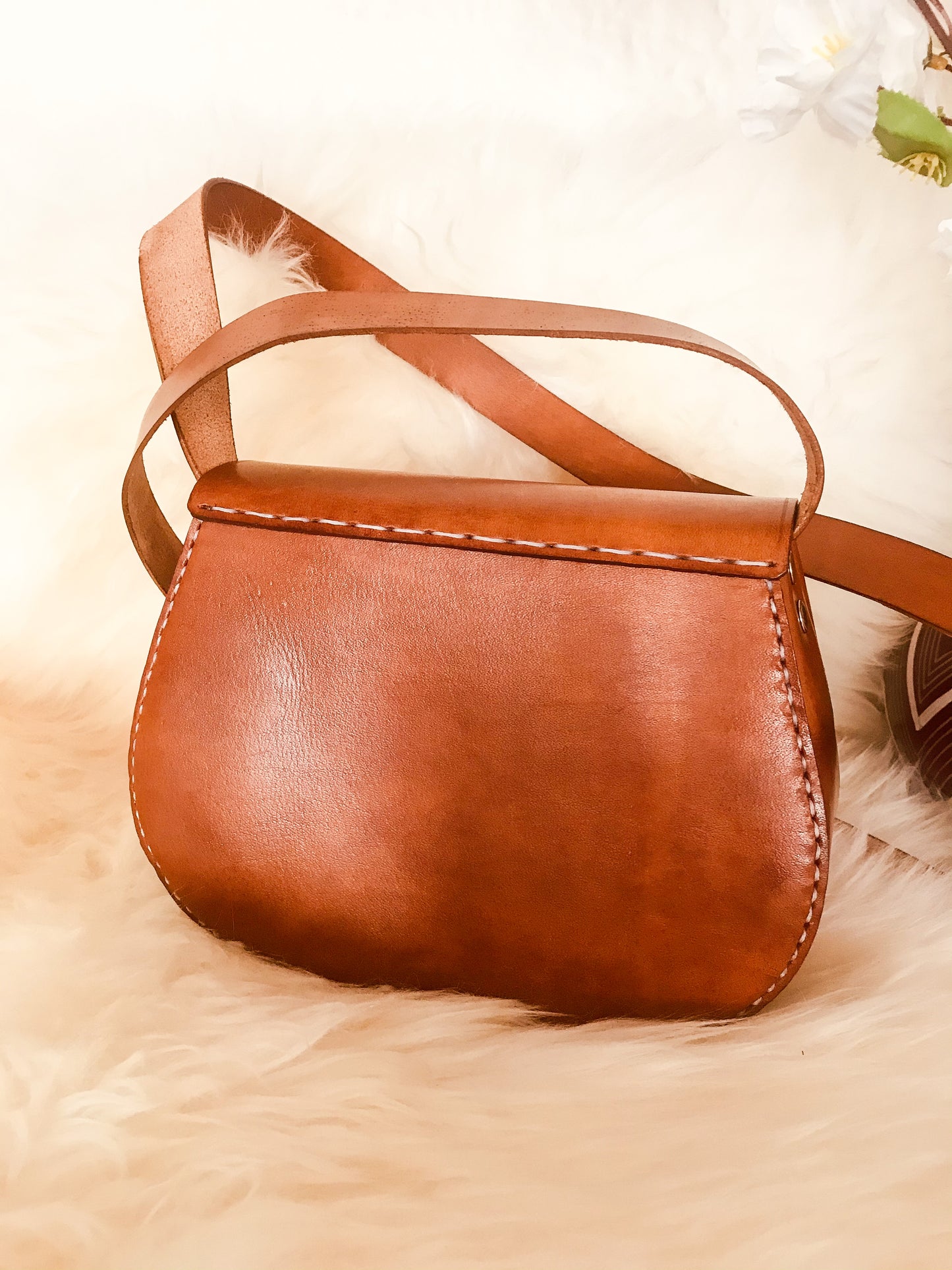 Back of a genuine leather tan handbag