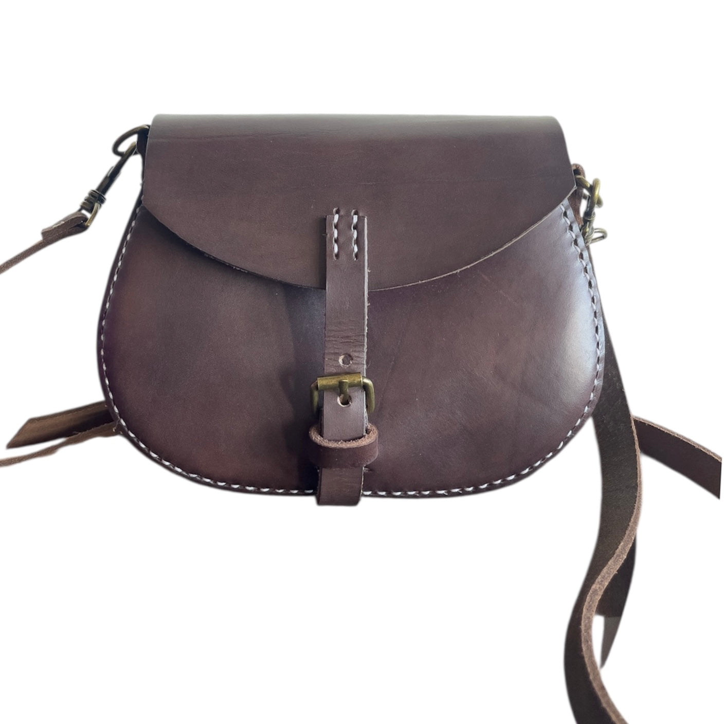 Brown leather saddle bag with strap on a white background