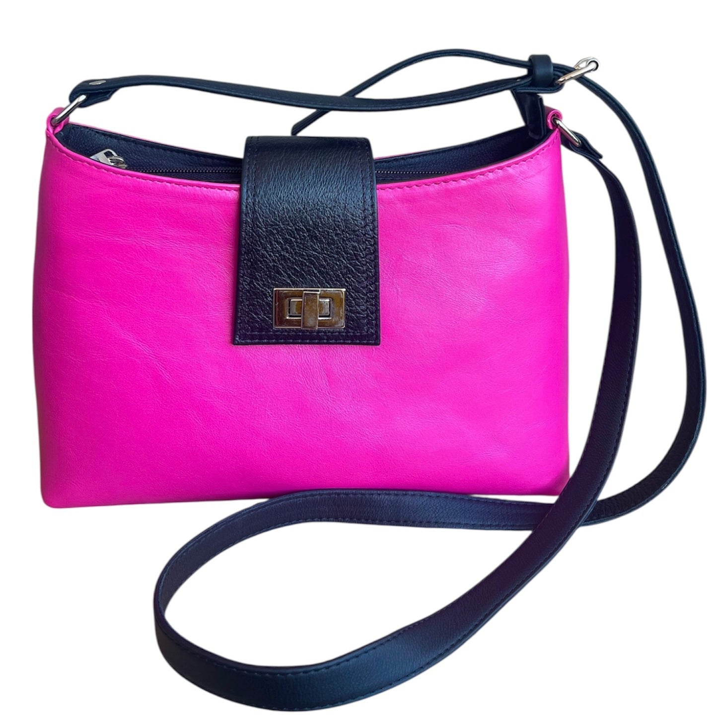 Pink handbag with black strap and trim on a white background