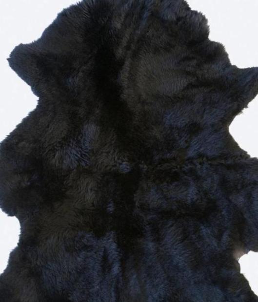 Genuine black sheepskin laid flat down